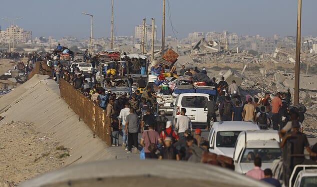 Fears are growing that Hamas may not be able to find all the bodies of the dead Israeli hostages due for release under Donald Trump ¿s ceasefire deal. Above, displaced Palestinians walk with their belongings along the coastal road towards Gaza City