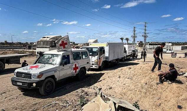 Hamas will hand over four more bodies of Israeli hostages tonight, officials say, as all four previous remains returned to Israel have been identified. Pictured: A team of Red Cross experts seen driving through Gaza today