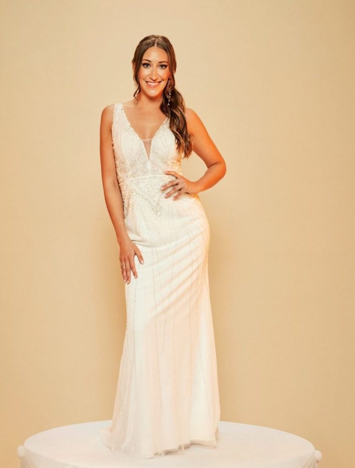 Hannah Norburn, a new bride from MAFS, posing in a white wedding dress.