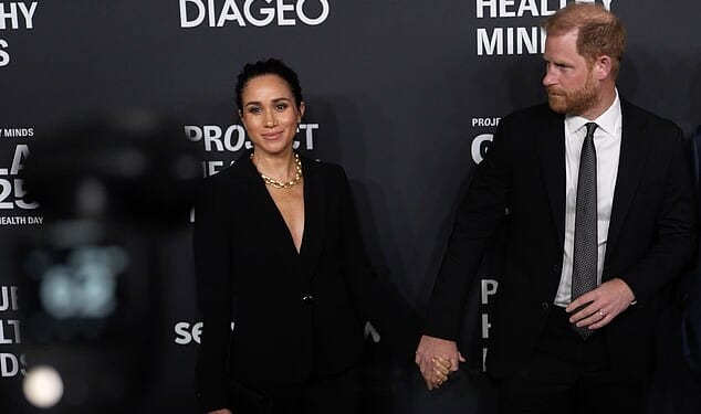 Prince Harry shuffles away as Meghan pauses for one more photo in New York last night