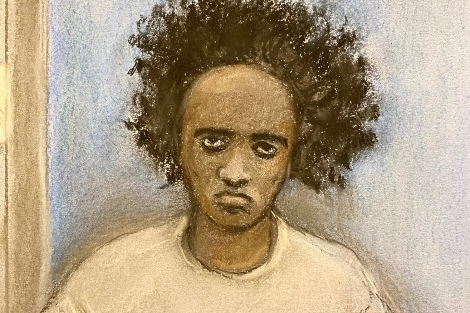 Illustration of Axel Rudakubana, a Black man with a serious expression and dark curly hair, wearing a light-colored top, sitting at a wooden table in a courtroom.