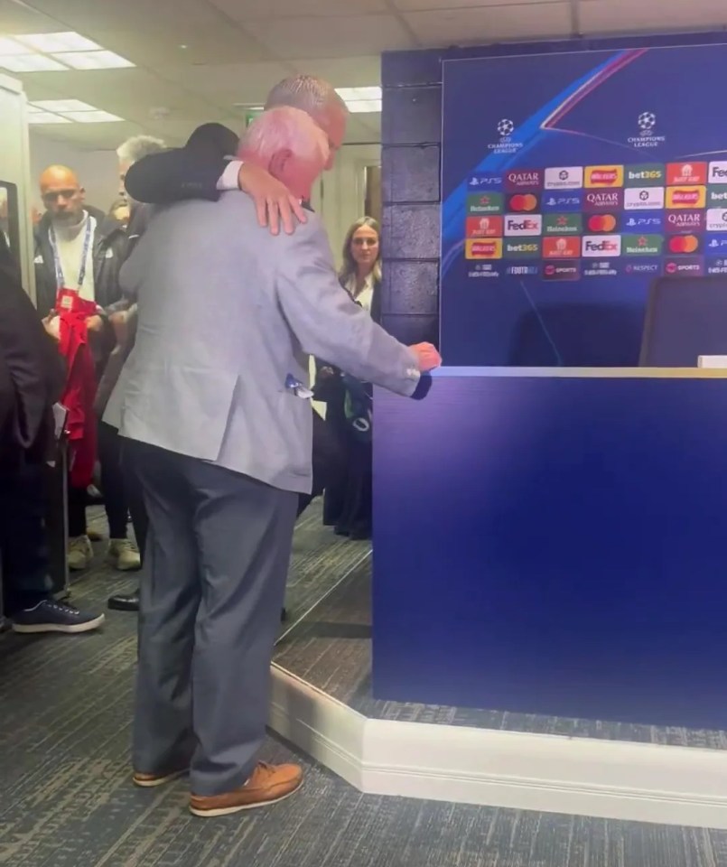 Jose Mourinho hugging a man at a press conference, with "Champions League" branding in the background.