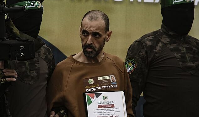 Changed: Eli Sharabi is escorted by Palestinian fighters  as he is handed over to the Red Cross on 8th February 2025