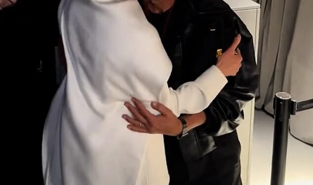 Meghan Markle shares an awkward kiss with Italian fashion designer Pierpaolo Piccioli as she made a surprise appearance at Paris Fashion Week that he helped make happen for her