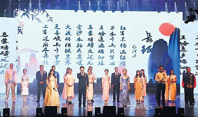 Christopher Cash (far right) and his friend Christopher Berry (far left) are pictured on stage at a school event in China where they were working as teachers
