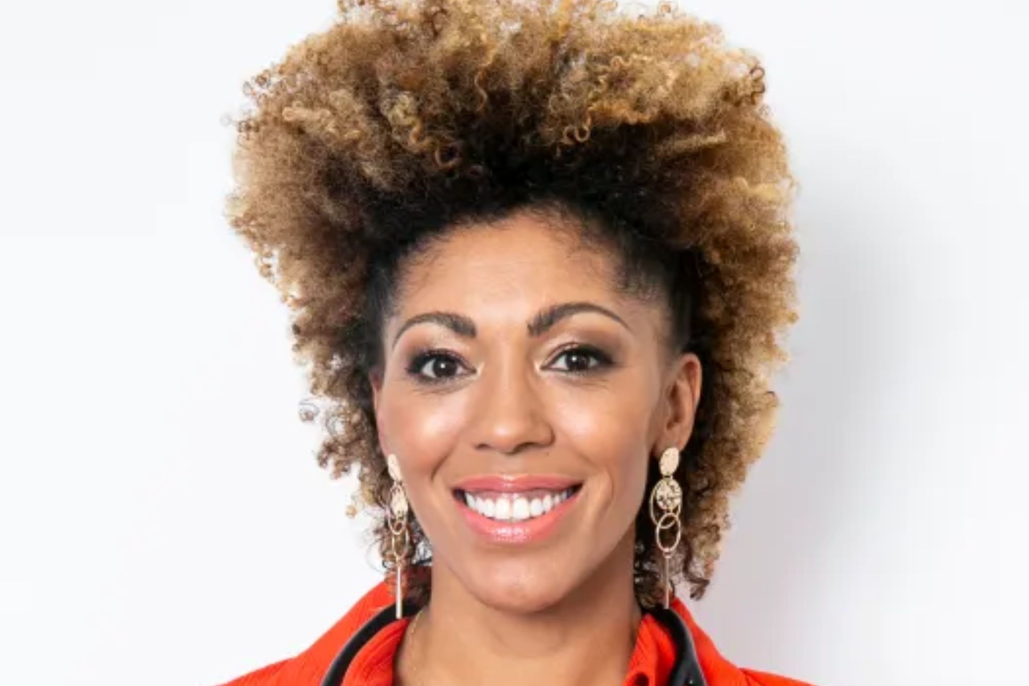 An image collage containing 1 images, Image 1 shows Smiling woman wearing an orange top, blue pants, and a stethoscope