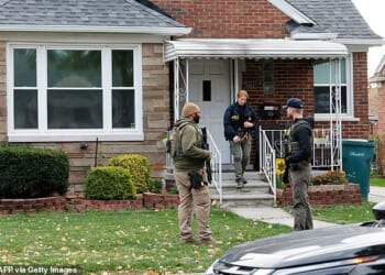 Members of the FBI Joint Terrorism Task Force search a home in Dearborn, Michigan, on Friday