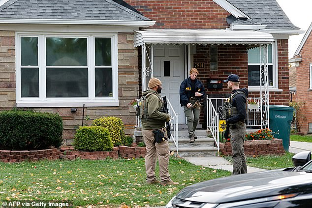 Members of the FBI Joint Terrorism Task Force search a home in Dearborn, Michigan, on Friday