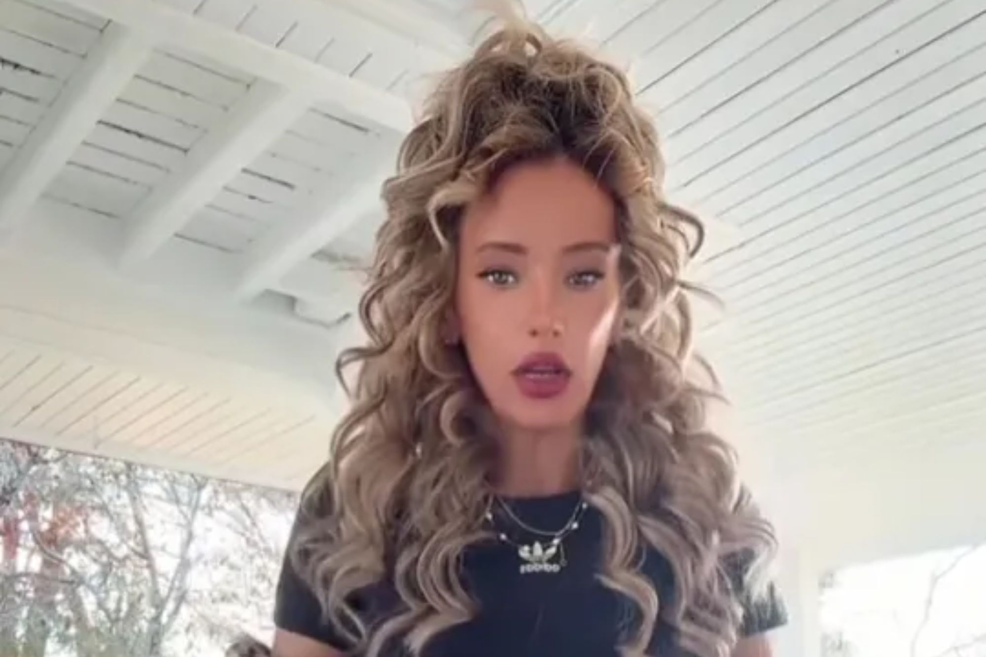 An image collage containing 1 images, Image 1 shows A woman with long curly hair wearing a black crop top and jeans, with text stating "I turned 45 yesterday I've been pregnant seven times"