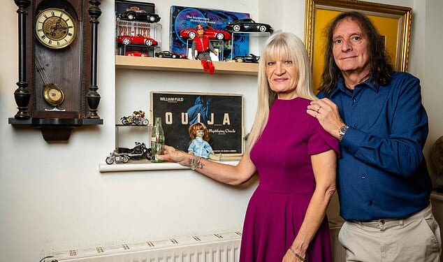 Chris Benwell and his fiancée Pam Webb next to the shelves that three glass ornaments fell from. 'We’re still finding bits of glass even today,' Pam, 61, says