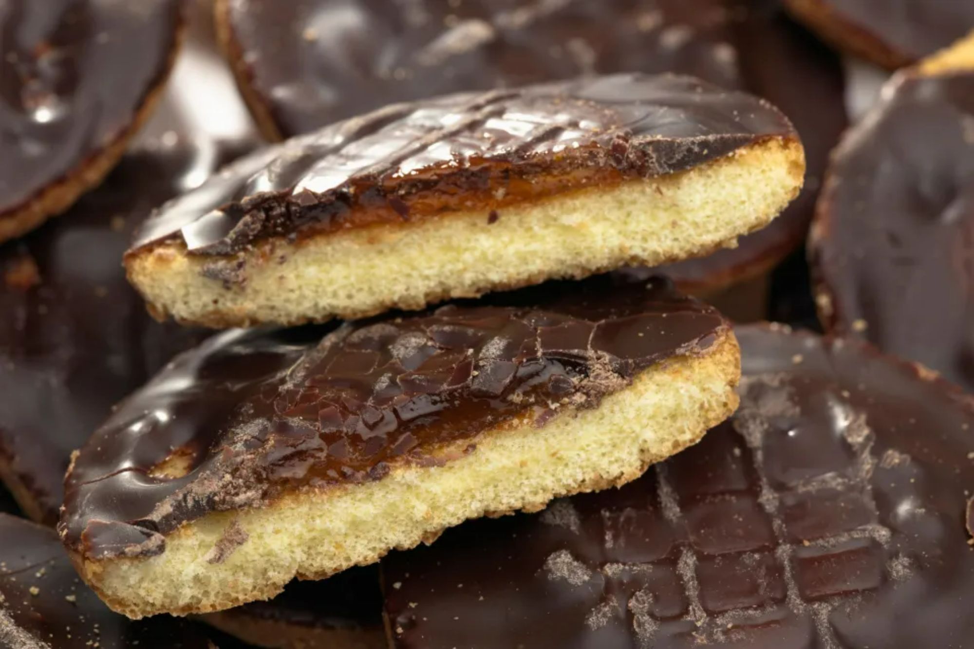 An image collage containing 1 images, Image 1 shows Halved Jaffa cake