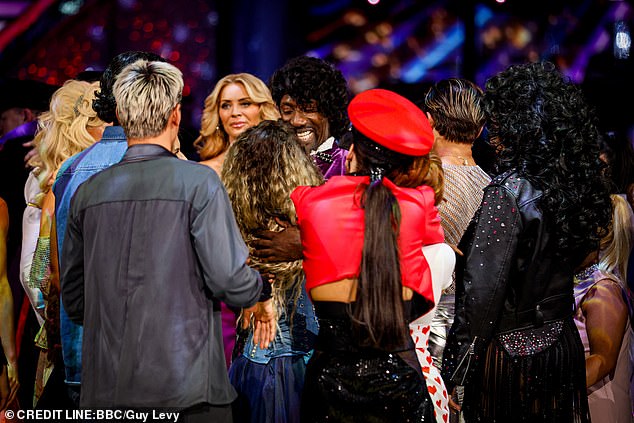 The departing couple were surrounded by the remaining contestants as they said their goodbyes during Sunday evening's show