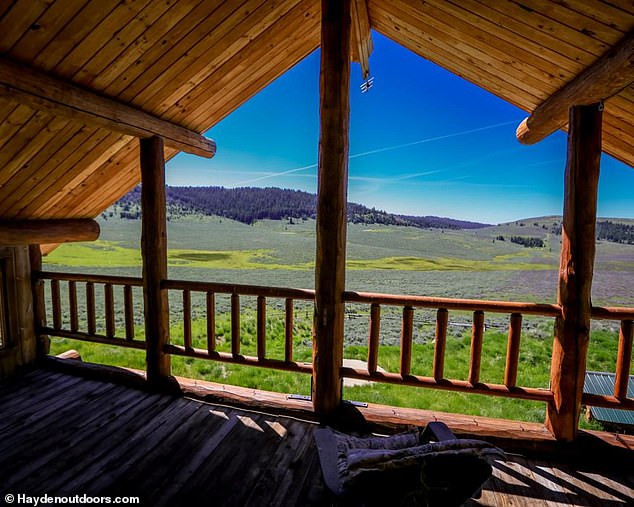 The Bighorn property is surrounded by National Forest lands and features tree-lined canyons, open meadows, cattle operations, abundant wildlife and rolling grass hills (pictured)