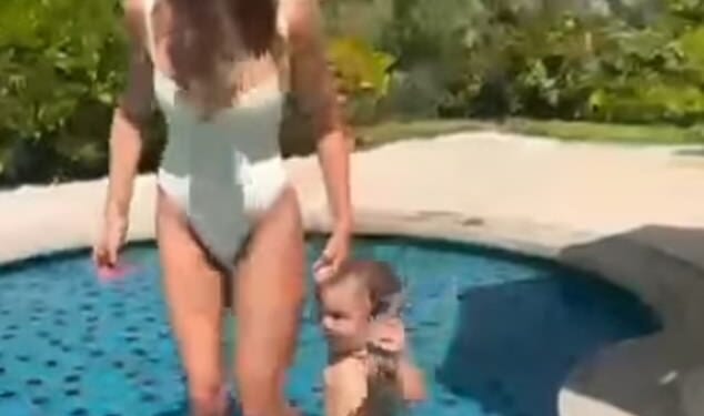 Karren Brady showed off her body transformation on Instagram in a white swimsuit as she spent quality time with her grandson on Sunday