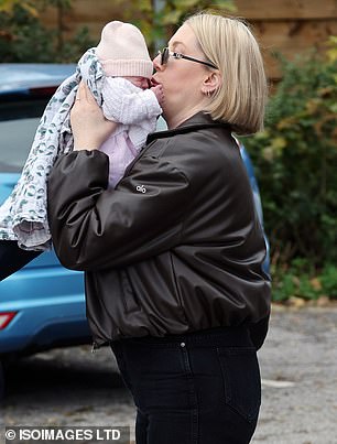 Katherine, who confirmed the birth on Saturday, was seen planting a kiss on her daughter's cheek as they arrived at a local restaurant in north London