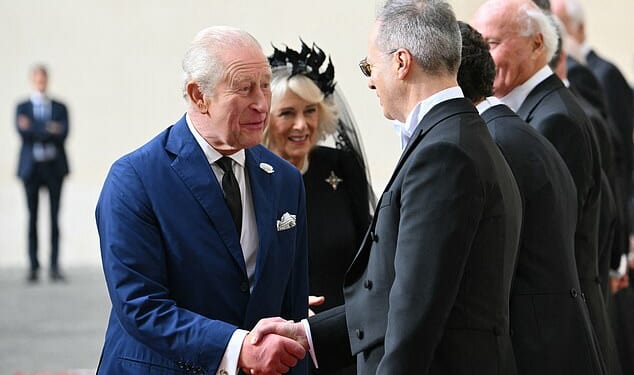 King Charles III and Queen Camilla are welcomed by officials at San Damaso Courtyard today