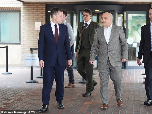 Shadow justice secretary Robert Jenrick (left) walks with Coskun outside Southwark Crown Court yesterday