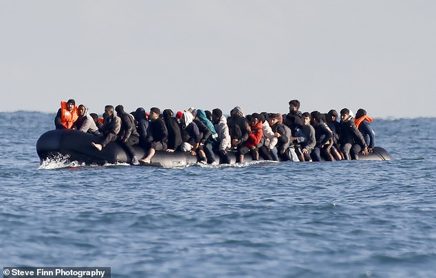 Migrants cross the Channel by small boat - heading for Britain - at the end of last month