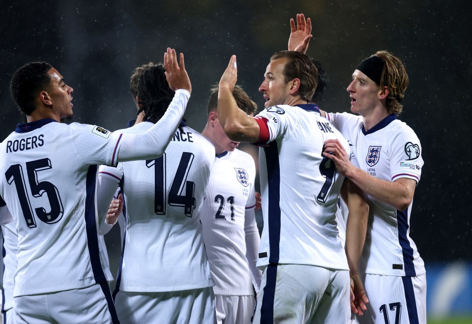 Morgan Rogers, Harry Kane, and Anthony Gordon celebrate a goal for England.