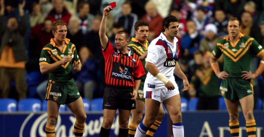 Adrian Morley of Great Britain being shown a red card by a referee.