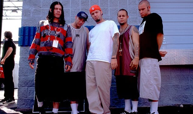 Limp Bizkit bassist Sam Rivers has passed away at the age of 48 on October 18 and received an emotional tribute from the iconic band; Rivers (far right) seen with band in 1997 in Chicago