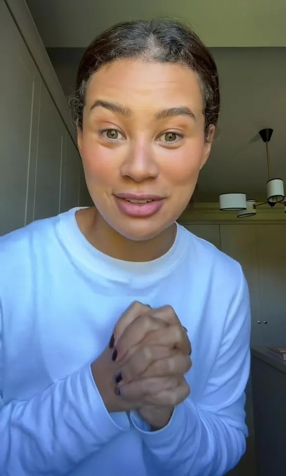 Montana Brown speaking directly to the camera with clasped hands.