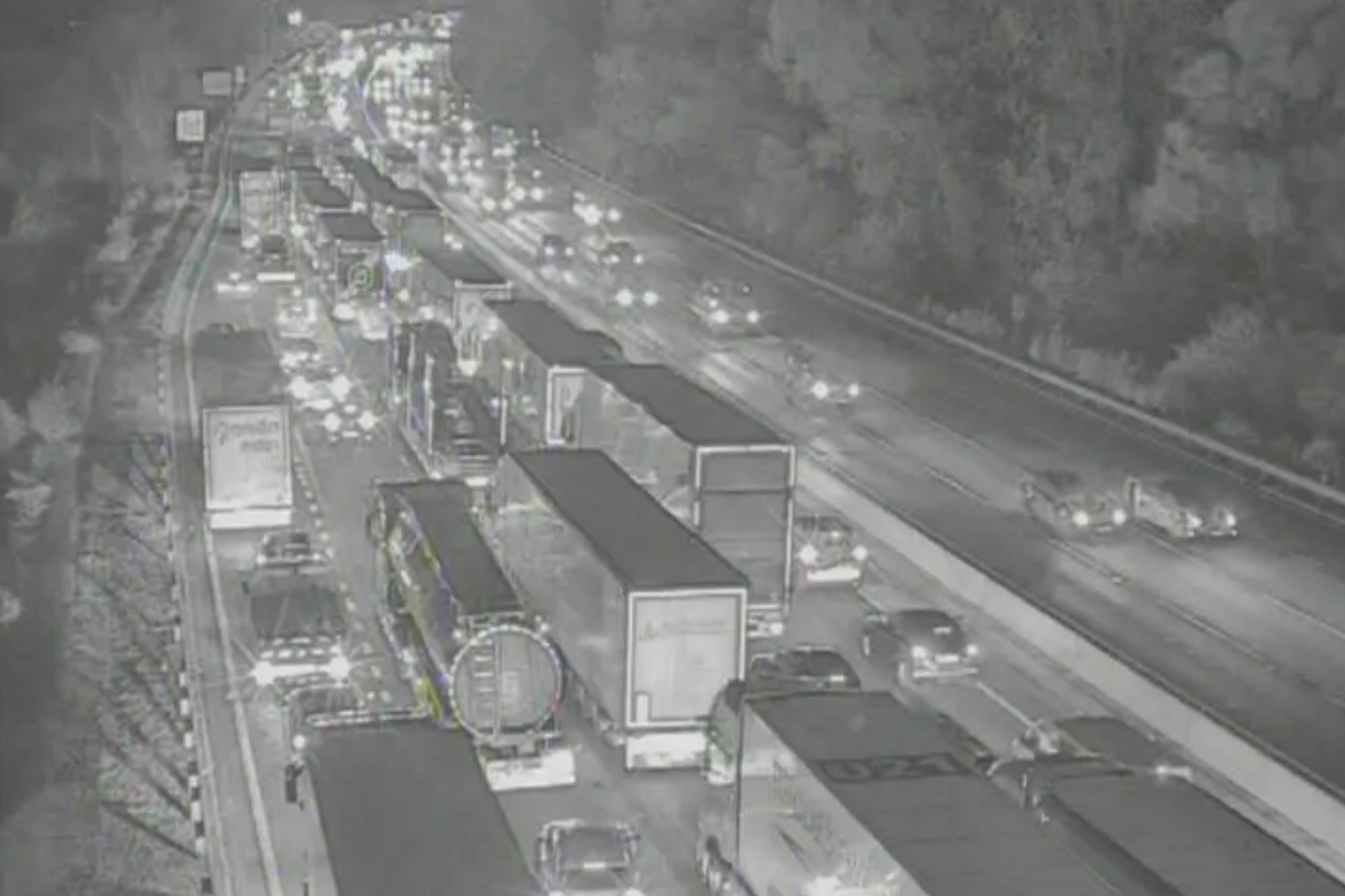 An image collage containing 1 images, Image 1 shows Infrared image of heavy traffic on a multi-lane highway at night