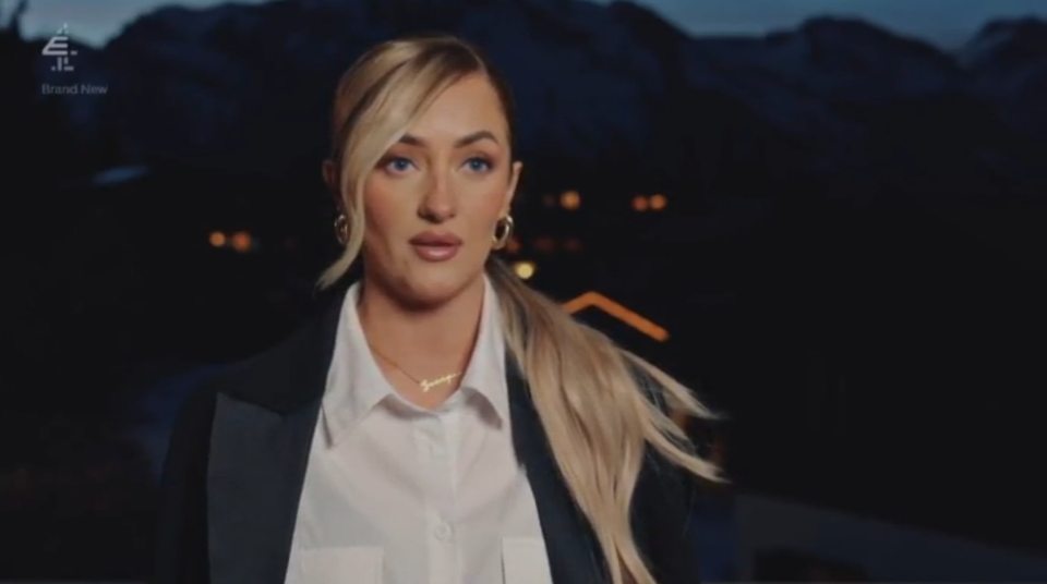 Leigh from Married at First Sight (MAFS) wearing a white collared shirt and black jacket.