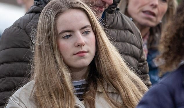 Amelie McCann pictured at a vigil for missing Madeleine held annually in Leicestershire (her father Gerry and mother, Kate, are pictured rear)