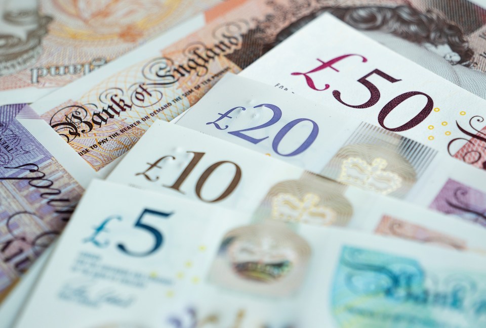 Close-up of British five, ten, twenty, and fifty pound notes.