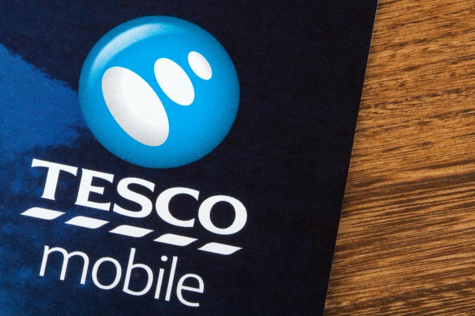 Close-up of the Tesco Mobile logo on a promotional leaflet.