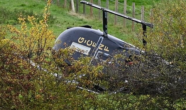 The helicopter landed on its side in a field near an industrial estate in Bentley shortly after 10am
