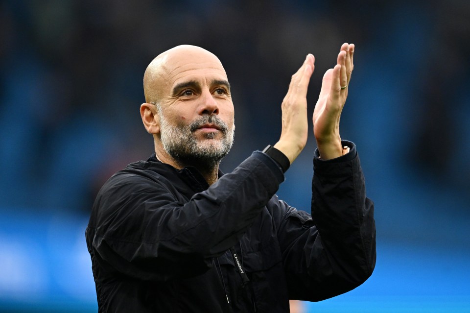 Manchester City manager Pep Guardiola applauding the fans.