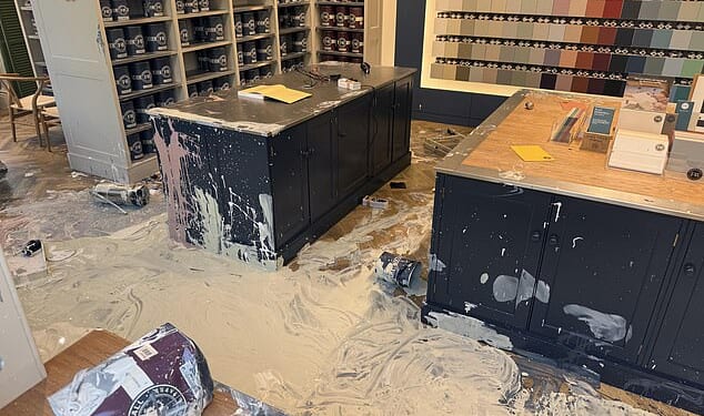 The paint shop was cordoned off as a man inside the store violently broke the glass and smeared colurs across the floors and counters