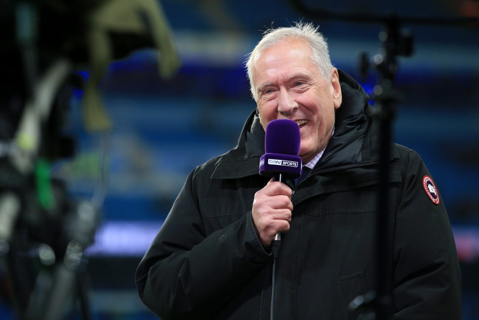 Commentator Martin Tyler speaks into a beIN Sports microphone.