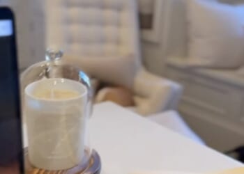 Ahead of the launch on Tuesday afternoon, the Duchess of Sussex, 44, shared a clip of her working at her laptop and perched on her desk was one of her new $64 candles and a blue notebook with her royal cypher embossed in gold on the cover (pictured right)