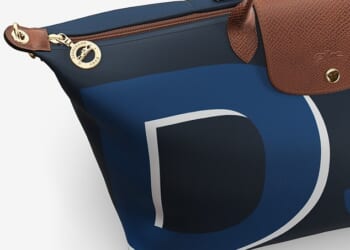 In footage shared on Instagram, eagle-eyed fans quickly spotted Meghan's new Longchamp Travel Bag, emblazoned with 'DS' - a nod to her royal title, the Duchess of Sussex