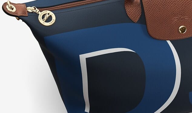 In footage shared on Instagram, eagle-eyed fans quickly spotted Meghan's new Longchamp Travel Bag, emblazoned with 'DS' - a nod to her royal title, the Duchess of Sussex