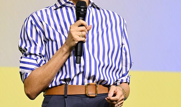 Meghan takes to stage again after being named Humanitarian of the Year - as Prince Harry tells how Covid brought 'surge in anxiety and depression'