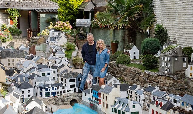 Lee and Julie Gregory pictured with the Model Village Polperro, Cornwall