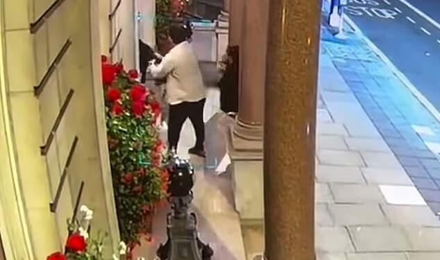 This is the moment a US events company boss was ambushed in Mayfair by crooks who snatched his watch from his wrist