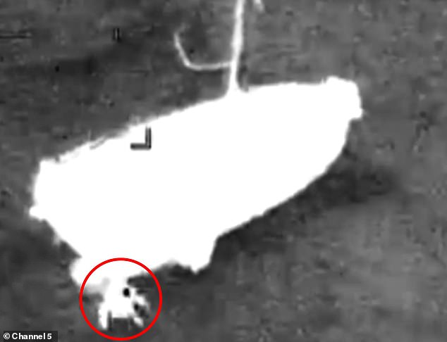 The yachtsman jumps into the water as the coastguard helicopter crew race to save him