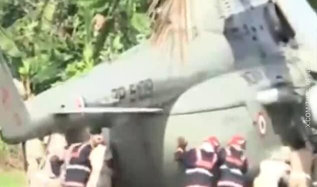 Emergency services rushed to push the President of India's helicopter after it became stuck in freshly poured concrete on Wednesday