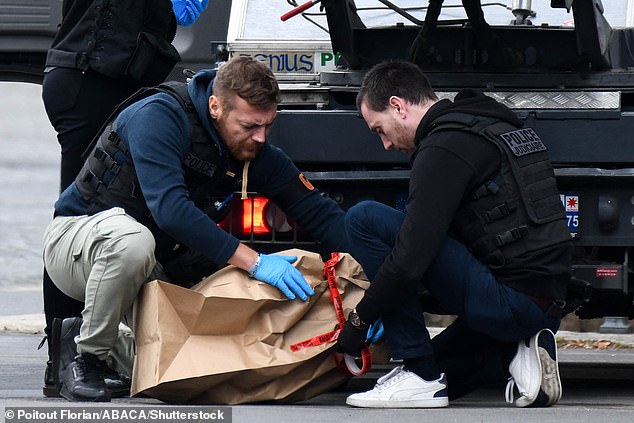Investigators were seen at the Louvre this afternoon after it was placed into lockdown