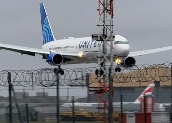 Dramatic footage taken shows the plane from New York unable to perform its landing due to the strong gusts at the London airport