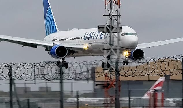 Dramatic footage taken shows the plane from New York unable to perform its landing due to the strong gusts at the London airport