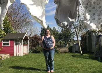 Jacqui Hunter pictured at home among the baby–gros picked out for Olivia before tragedy struck. She died giving birth to Olivia stillborn