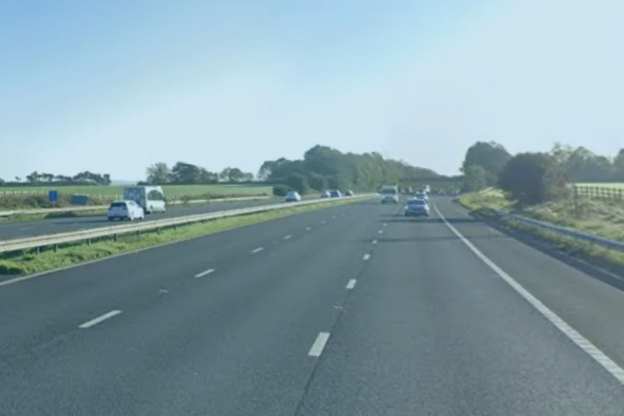 An image collage containing 1 images, Image 1 shows Motorway with cars and countryside