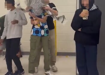 Several Muslim teens at one of Virginia¿s elite high schools were suspended after staging an 'antisemitic' skit where a student wrapped a keffiyeh around a classmate¿s head and pretended to kidnap him (pictured)