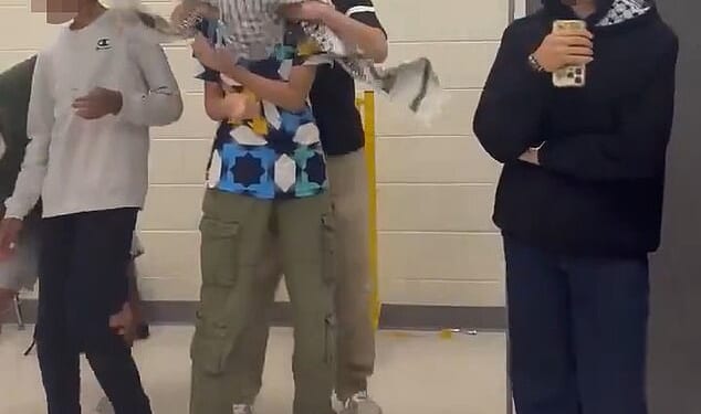 Several Muslim teens at one of Virginia¿s elite high schools were suspended after staging an 'antisemitic' skit where a student wrapped a keffiyeh around a classmate¿s head and pretended to kidnap him (pictured)